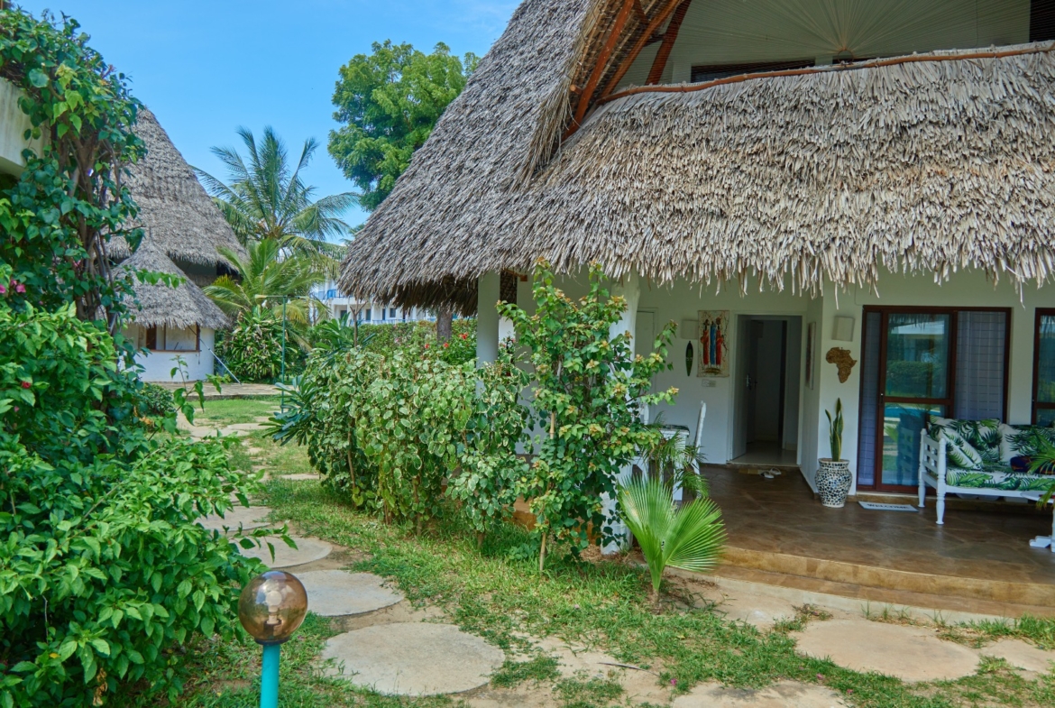Fully furnished 2-bedroom duplex cottage for sale at Park Marine Villas, Silversands Road Malindi. Each floor has a bedroom. Steps to beach, 2 pools. €125,000.