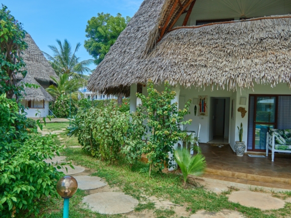 Fully furnished 2-bedroom duplex cottage for sale at Park Marine Villas, Silversands Road Malindi. Each floor has a bedroom. Steps to beach, 2 pools. €125,000.