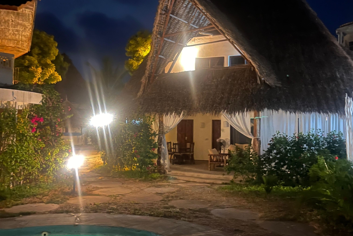 Fully furnished 2-bedroom duplex cottage for sale at Park Marine Villas, Silversands Road Malindi. Each floor has a bedroom. Steps to beach, 2 pools. €125,000.