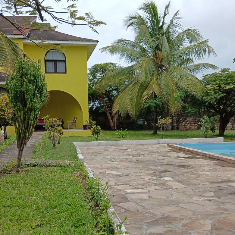 3-bedroom furnished villa for rent in Malindi, off Lamu Road next to Galana Petrol Station, with landscaped garden and shared swimming pool.