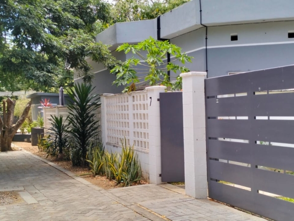 “Gated half-acre plot for sale inside Fahari Residence, Malindi – secure and serviced coastal property.”