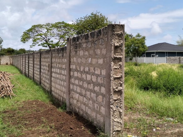 “Gated half-acre plot for sale inside Fahari Residence, Malindi – secure and serviced coastal property.”