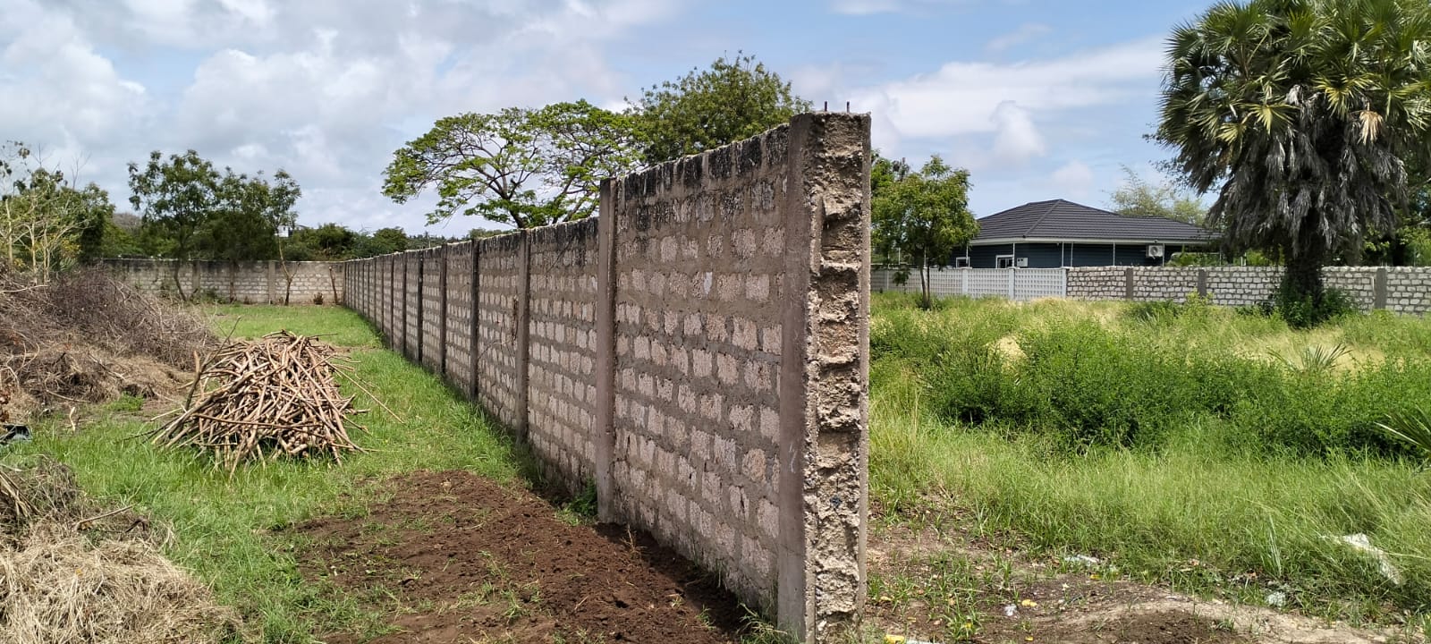 “Gated half-acre plot for sale inside Fahari Residence, Malindi – secure and serviced coastal property.”