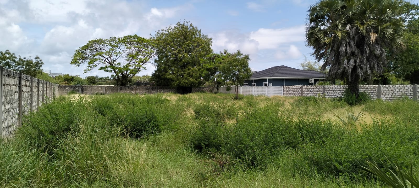 “Gated half-acre plot for sale inside Fahari Residence, Malindi – secure and serviced coastal property.”