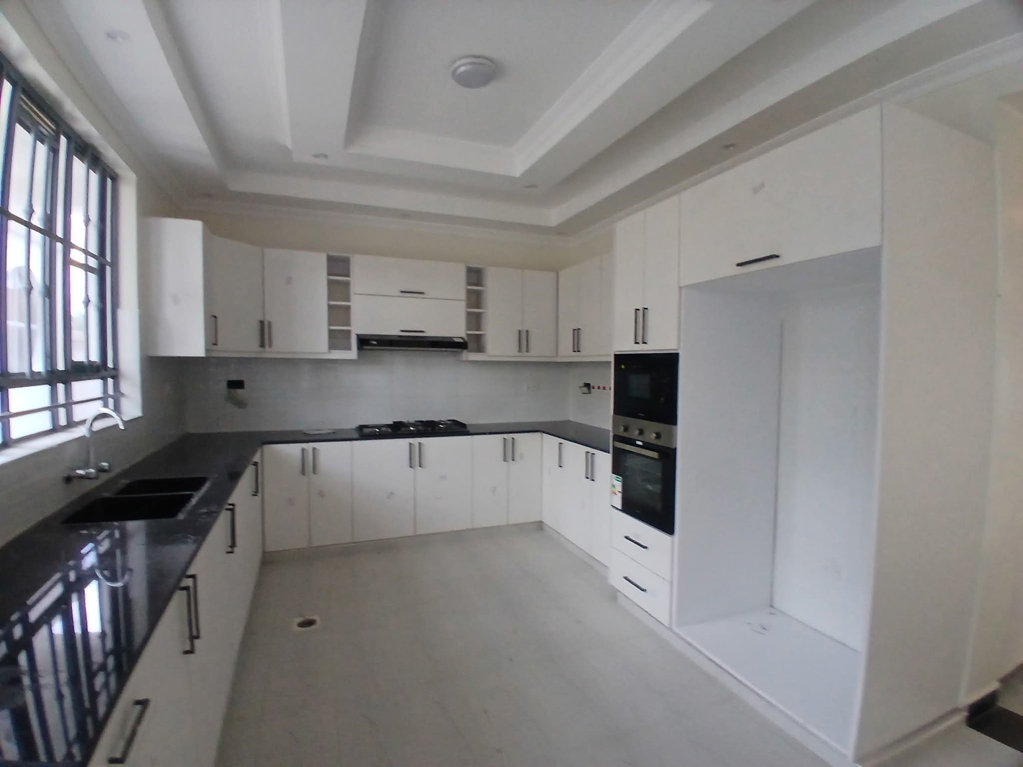 Executive 4-bedroom all-en-suite mansion for sale in Ruiru Mugutha. Gated community of 6 units, 40/80 plot, smart lighting, fitted kitchen, DSQ, and solar heating. Only 3.5 km from Thika Road. Asking KSh 22M.