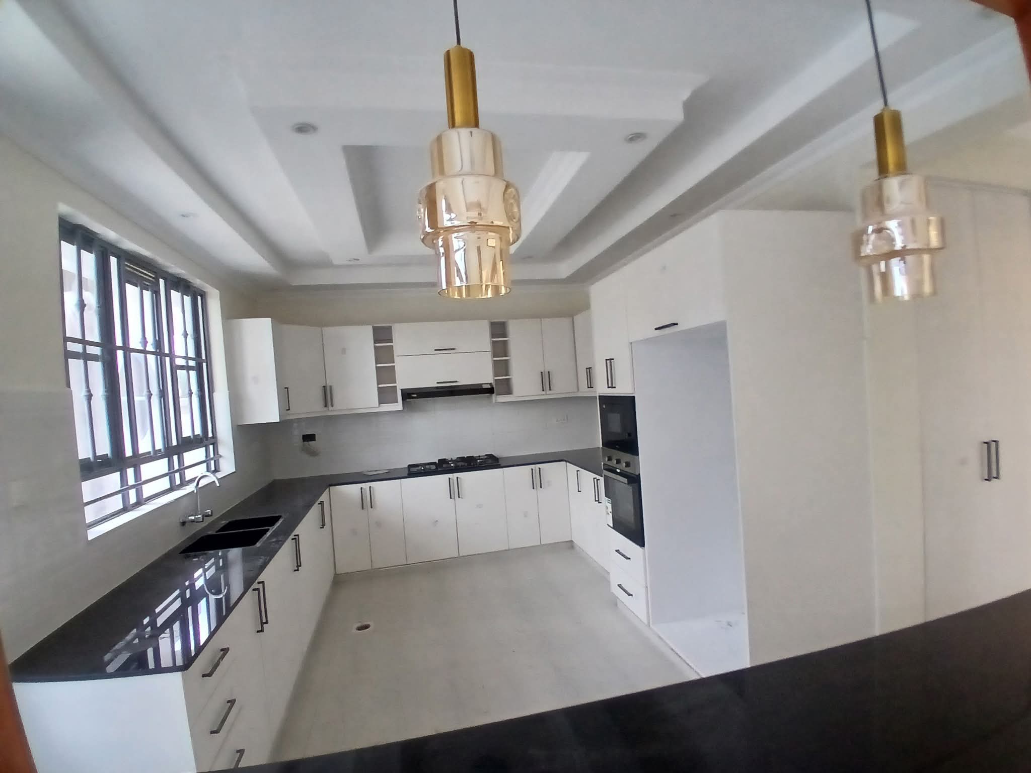 Executive 4-bedroom all-en-suite mansion for sale in Ruiru Mugutha. Gated community of 6 units, 40/80 plot, smart lighting, fitted kitchen, DSQ, and solar heating. Only 3.5 km from Thika Road. Asking KSh 22M.