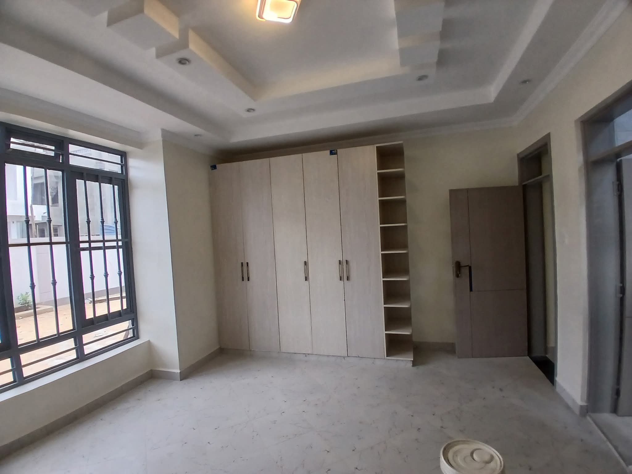 Executive 4-bedroom all-en-suite mansion for sale in Ruiru Mugutha. Gated community of 6 units, 40/80 plot, smart lighting, fitted kitchen, DSQ, and solar heating. Only 3.5 km from Thika Road. Asking KSh 22M.