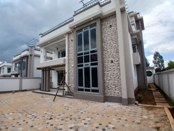Step into refined suburban living with this Executive Elegant 4-Bedroom All-En-Suite Mansion plus Family Room and DSQ, located in the serene neighbourhood of Ruiru Mugutha. Nestled within an exclusive gated community of only 6 units, this home offers the perfect blend of luxury, comfort, and privacy on a 40x80 plot. From the spacious lounge and semi open-plan fitted kitchen to the master suite with walk-in closet and smart modern finishes, every detail of this residence speaks sophistication. An ideal home for families seeking space, security, and modern living — just 3.5 km from Thika Road and 200m from tarmac access. 📍 Location Highlights This property is strategically positioned in Ruiru Mugutha, one of the most rapidly developing and secure suburbs along the Thika Superhighway. 🛣️ Accessibility: 200m from the main tarmac road and only 3.5km to Thika Road 🛍️ Shopping & Amenities: Close to Spur Mall and major retail outlets 🎓 Education: Nearby top schools such as Lizzy Wanyoike Preparatory 🏡 Community: Peaceful gated estate with perimeter wall and guard house 🚗 Convenience: Easy access to Nairobi CBD and Thika Town via the Superhighway This location combines suburban tranquility with urban connectivity — ideal for families and professionals. 🌟 Property Overview Property Type: Executive 4-Bedroom Mansion Status: For Sale Price: KSh 22 Million Land Size: 40/80 (approx. 0.045 acres) Location: Ruiru Mugutha, Kiambu County Community: 6-unit gated estate 🏠 Property Features Interior Features 🛋️ Spacious Lounge & Dining Area 🍳 Semi Open-Plan Fitted Kitchen with hood, cooker, and microwave 🛏️ 4 Bedrooms All En-suite with modern finishes 🚿 Glass Shower Cubicles in all bathrooms 🧺 Laundry Room 🧑‍🍳 DSQ (Domestic Staff Quarters) with private entry 🪞 Master Bedroom with Walk-in Closet 🪜 Friendly Staircases for easy access 💡 Smart Lighting System 🪟 Large Windows providing natural light and ventilation ☀️ Solar Water Heating System 🧘 Family Room / Gym / Office / Prayer Room for versatility Exterior & Structural Features 🏡 Gated Community of 6 Units 🔒 Electric & Razor Perimeter Wall around the estate 🚪 Sliding Gate & Guard House for added security 🚗 Cabro-Paved Driveway & Ample Parking 🌸 Landscaped Garden with Lawn Grass & Flower Beds 💧 10,000-Litre Underground Water Tank 🌍 Safaricom Fibre Ready for Fast Internet 🧱 Modern Finishes & Solid Construction 🌳 Lifestyle & Comfort This mansion is designed for comfortable, family-oriented living with attention to space, style, and serenity. Enjoy quiet evenings in your garden, family gatherings in the open-plan living space, or a home workout in your private gym room. The neighbourhood offers a secure, family-friendly environment, excellent schools, reliable utilities, and quick access to key amenities — everything a discerning homeowner seeks in a modern suburban home. 💼 Investment Potential Located in one of Ruiru’s fastest-growing residential areas Ideal for families seeking a long-term residence or investors eyeing rental income from executive tenants High property appreciation rate in Mugutha and nearby Thika Road developments Strong demand for modern gated community homes in this price range With its blend of privacy, convenience, and luxury, this property represents exceptional value for the asking price of KSh 22 Million. ✅ Key Selling Points 4 All-En-suite Bedrooms + Family Room + DSQ Spacious Lounge and Dining Area Semi Open-Plan Fitted Kitchen (with Hood, Cooker & Microwave) Solar Water Heating & Smart Lighting Gated Estate of 6 Units with Razor/Perimeter Wall Guard House & Sliding Gate for Security 10,000-Litre Underground Water Tank Safaricom Fibre Ready Cabro Driveway, Lawn & Flower Garden Only 3.5 km from Thika Road, 200m from Tarmac Asking Price: KSh 22,000,000 📞 Book a Viewing Today Make this Executive 4-Bedroom Mansion in Ruiru Mugutha your new home. For viewings and inquiries, contact: 📲 Call / WhatsApp: +254 724 568 989 📧 Email: info@mkaazirealestate.com Experience refined living in a secure and serene gated community — exclusively from Mkaazi Real Estate LTD.