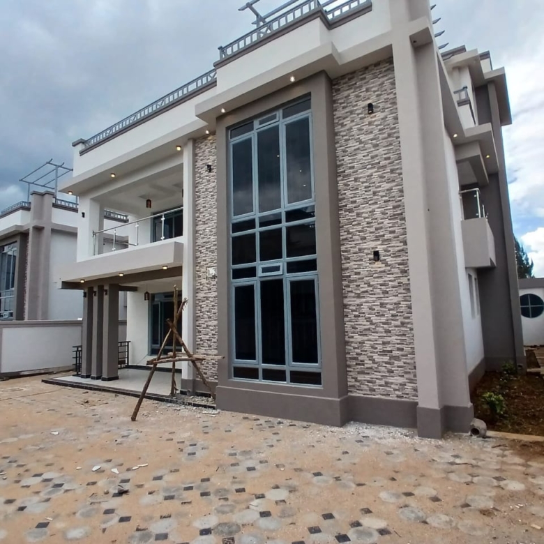 Step into refined suburban living with this Executive Elegant 4-Bedroom All-En-Suite Mansion plus Family Room and DSQ, located in the serene neighbourhood of Ruiru Mugutha. Nestled within an exclusive gated community of only 6 units, this home offers the perfect blend of luxury, comfort, and privacy on a 40x80 plot. From the spacious lounge and semi open-plan fitted kitchen to the master suite with walk-in closet and smart modern finishes, every detail of this residence speaks sophistication. An ideal home for families seeking space, security, and modern living — just 3.5 km from Thika Road and 200m from tarmac access. 📍 Location Highlights This property is strategically positioned in Ruiru Mugutha, one of the most rapidly developing and secure suburbs along the Thika Superhighway. 🛣️ Accessibility: 200m from the main tarmac road and only 3.5km to Thika Road 🛍️ Shopping & Amenities: Close to Spur Mall and major retail outlets 🎓 Education: Nearby top schools such as Lizzy Wanyoike Preparatory 🏡 Community: Peaceful gated estate with perimeter wall and guard house 🚗 Convenience: Easy access to Nairobi CBD and Thika Town via the Superhighway This location combines suburban tranquility with urban connectivity — ideal for families and professionals. 🌟 Property Overview Property Type: Executive 4-Bedroom Mansion Status: For Sale Price: KSh 22 Million Land Size: 40/80 (approx. 0.045 acres) Location: Ruiru Mugutha, Kiambu County Community: 6-unit gated estate 🏠 Property Features Interior Features 🛋️ Spacious Lounge & Dining Area 🍳 Semi Open-Plan Fitted Kitchen with hood, cooker, and microwave 🛏️ 4 Bedrooms All En-suite with modern finishes 🚿 Glass Shower Cubicles in all bathrooms 🧺 Laundry Room 🧑‍🍳 DSQ (Domestic Staff Quarters) with private entry 🪞 Master Bedroom with Walk-in Closet 🪜 Friendly Staircases for easy access 💡 Smart Lighting System 🪟 Large Windows providing natural light and ventilation ☀️ Solar Water Heating System 🧘 Family Room / Gym / Office / Prayer Room for versatility Exterior & Structural Features 🏡 Gated Community of 6 Units 🔒 Electric & Razor Perimeter Wall around the estate 🚪 Sliding Gate & Guard House for added security 🚗 Cabro-Paved Driveway & Ample Parking 🌸 Landscaped Garden with Lawn Grass & Flower Beds 💧 10,000-Litre Underground Water Tank 🌍 Safaricom Fibre Ready for Fast Internet 🧱 Modern Finishes & Solid Construction 🌳 Lifestyle & Comfort This mansion is designed for comfortable, family-oriented living with attention to space, style, and serenity. Enjoy quiet evenings in your garden, family gatherings in the open-plan living space, or a home workout in your private gym room. The neighbourhood offers a secure, family-friendly environment, excellent schools, reliable utilities, and quick access to key amenities — everything a discerning homeowner seeks in a modern suburban home. 💼 Investment Potential Located in one of Ruiru’s fastest-growing residential areas Ideal for families seeking a long-term residence or investors eyeing rental income from executive tenants High property appreciation rate in Mugutha and nearby Thika Road developments Strong demand for modern gated community homes in this price range With its blend of privacy, convenience, and luxury, this property represents exceptional value for the asking price of KSh 22 Million. ✅ Key Selling Points 4 All-En-suite Bedrooms + Family Room + DSQ Spacious Lounge and Dining Area Semi Open-Plan Fitted Kitchen (with Hood, Cooker & Microwave) Solar Water Heating & Smart Lighting Gated Estate of 6 Units with Razor/Perimeter Wall Guard House & Sliding Gate for Security 10,000-Litre Underground Water Tank Safaricom Fibre Ready Cabro Driveway, Lawn & Flower Garden Only 3.5 km from Thika Road, 200m from Tarmac Asking Price: KSh 22,000,000 📞 Book a Viewing Today Make this Executive 4-Bedroom Mansion in Ruiru Mugutha your new home. For viewings and inquiries, contact: 📲 Call / WhatsApp: +254 724 568 989 📧 Email: info@mkaazirealestate.com Experience refined living in a secure and serene gated community — exclusively from Mkaazi Real Estate LTD.