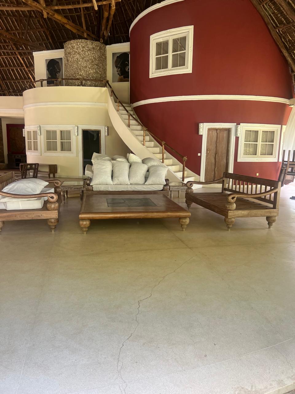 Prime 4-bedroom coastal home for sale in Kibokoni with a 2-bedroom guest suite earning USD 100 per night. Nearly half-acre plot, ideal for investors and families.