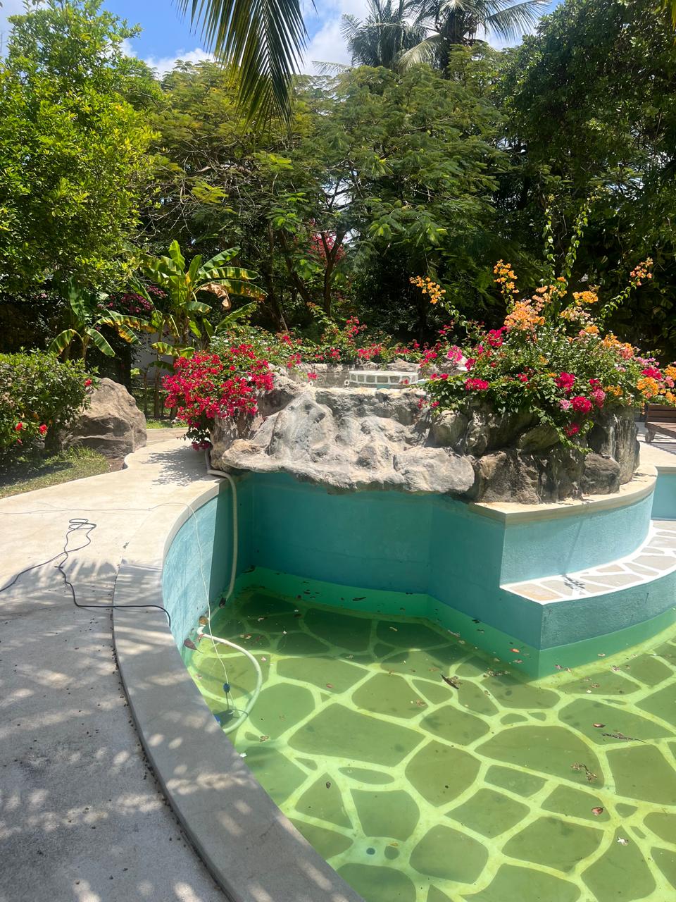 Prime 4-bedroom coastal home for sale in Kibokoni with a 2-bedroom guest suite earning USD 100 per night. Nearly half-acre plot, ideal for investors and families.