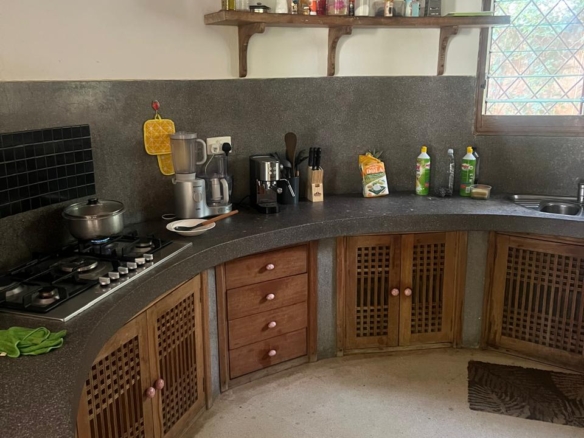 Prime 4-bedroom coastal home for sale in Kibokoni with a 2-bedroom guest suite earning USD 100 per night. Nearly half-acre plot, ideal for investors and families.