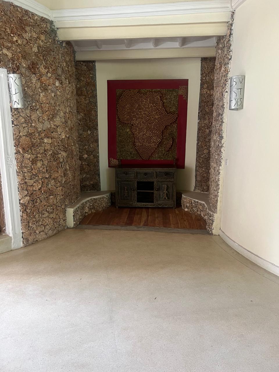 Prime 4-bedroom coastal home for sale in Kibokoni with a 2-bedroom guest suite earning USD 100 per night. Nearly half-acre plot, ideal for investors and families.