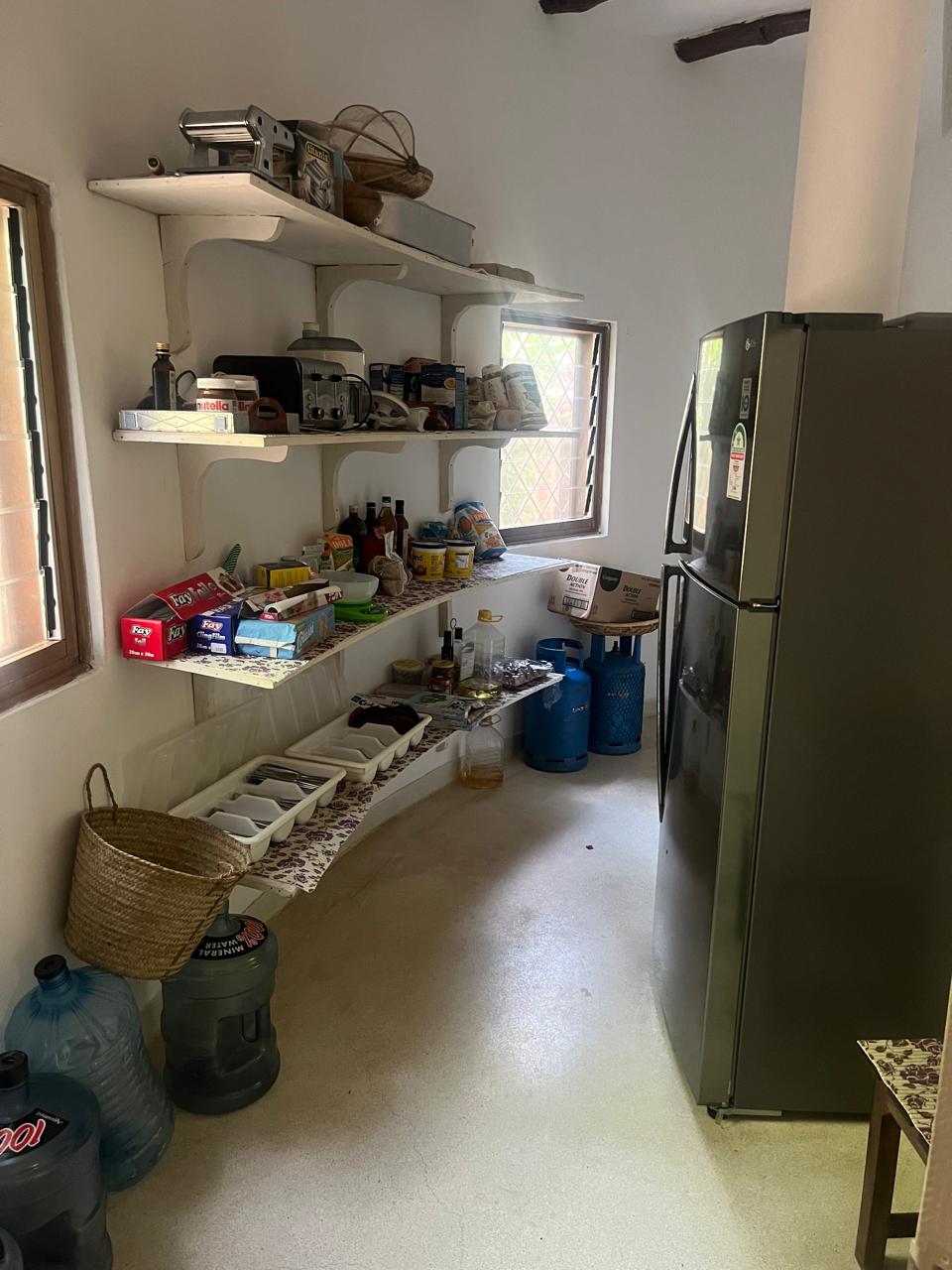 Prime 4-bedroom coastal home for sale in Kibokoni with a 2-bedroom guest suite earning USD 100 per night. Nearly half-acre plot, ideal for investors and families.