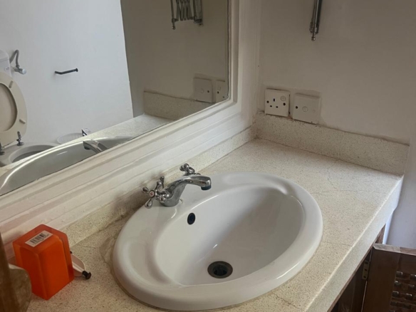 Prime 4-bedroom coastal home for sale in Kibokoni with a 2-bedroom guest suite earning USD 100 per night. Nearly half-acre plot, ideal for investors and families.