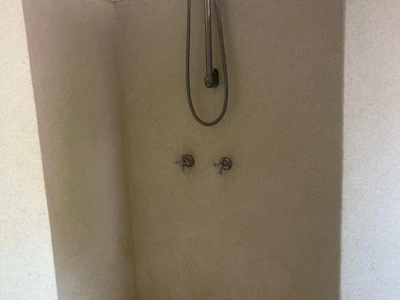 Prime 4-bedroom coastal home for sale in Kibokoni with a 2-bedroom guest suite earning USD 100 per night. Nearly half-acre plot, ideal for investors and families.