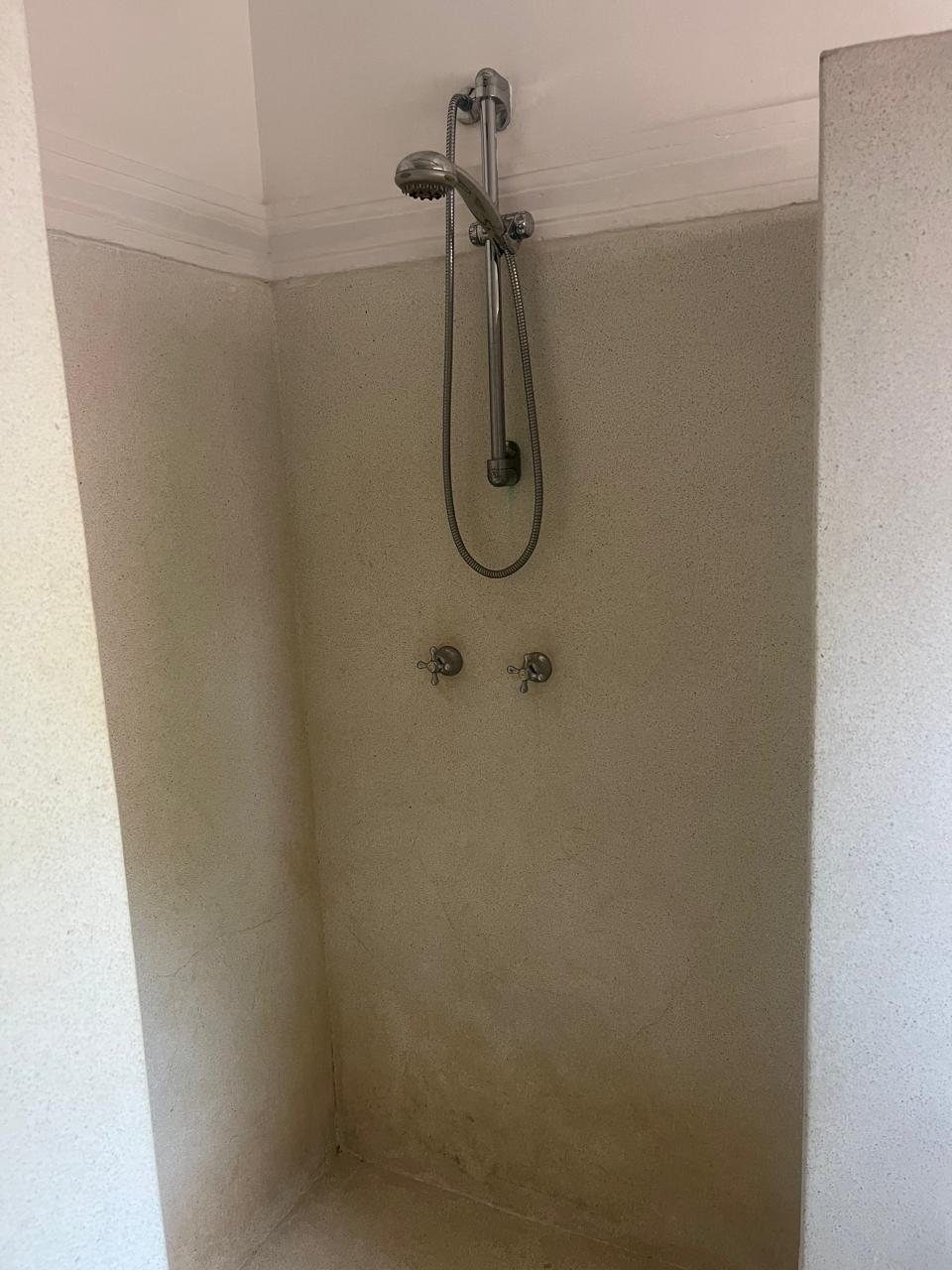 Prime 4-bedroom coastal home for sale in Kibokoni with a 2-bedroom guest suite earning USD 100 per night. Nearly half-acre plot, ideal for investors and families.