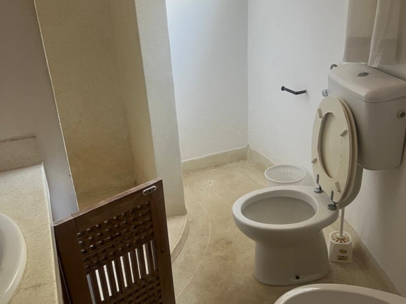 Prime 4-bedroom coastal home for sale in Kibokoni with a 2-bedroom guest suite earning USD 100 per night. Nearly half-acre plot, ideal for investors and families.