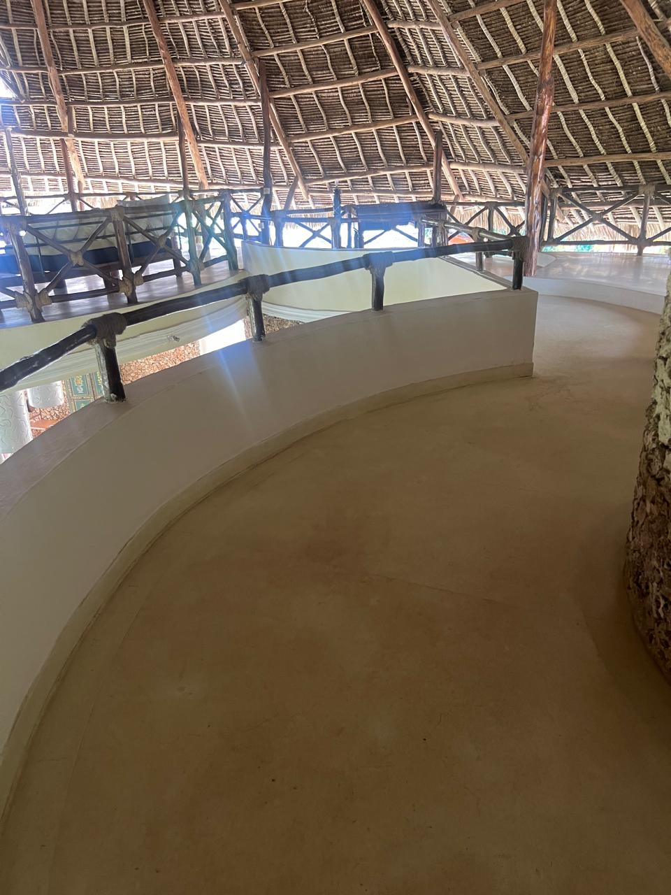 Prime 4-bedroom coastal home for sale in Kibokoni with a 2-bedroom guest suite earning USD 100 per night. Nearly half-acre plot, ideal for investors and families.