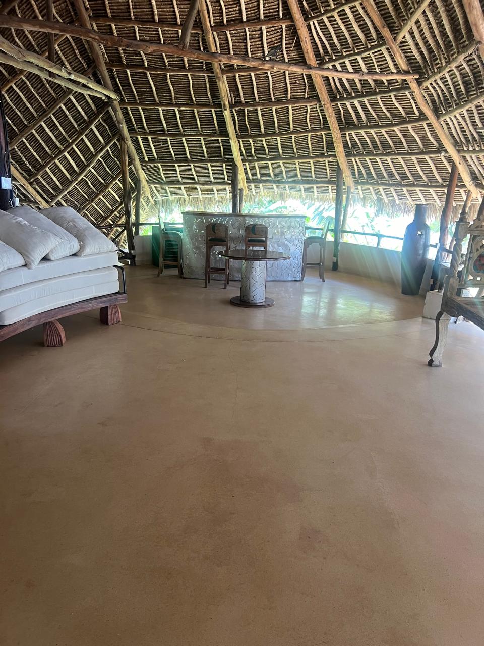 Prime 4-bedroom coastal home for sale in Kibokoni with a 2-bedroom guest suite earning USD 100 per night. Nearly half-acre plot, ideal for investors and families.