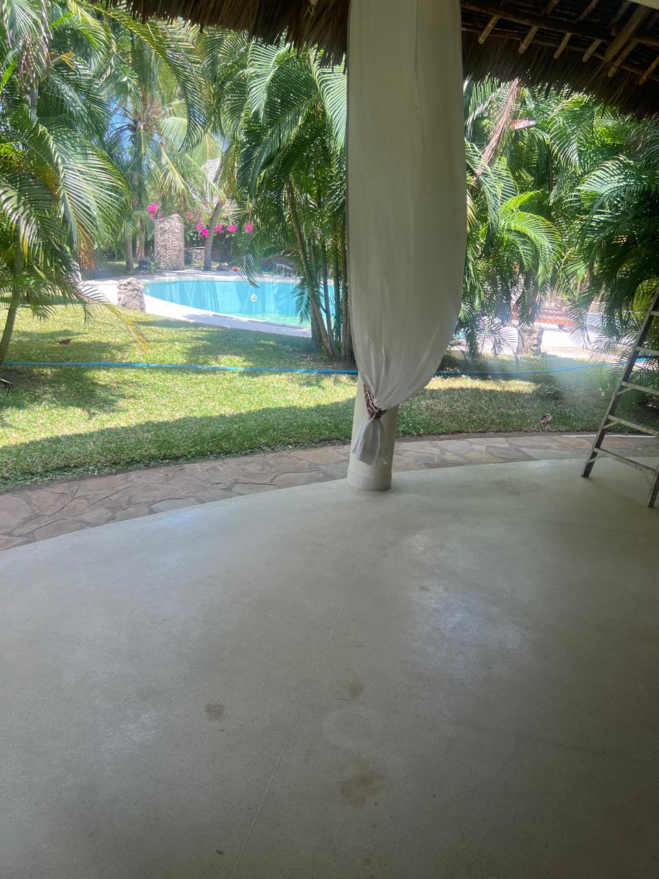 Prime 4-bedroom coastal home for sale in Kibokoni with a 2-bedroom guest suite earning USD 100 per night. Nearly half-acre plot, ideal for investors and families.