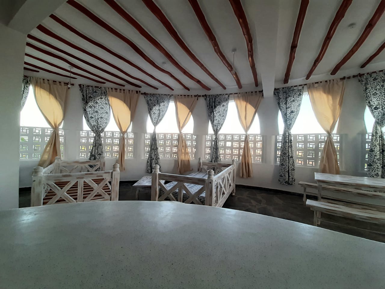 Luxury 2-bedroom guest suite in Mayungu, Malindi featuring ocean views, ensuite rooms, shared kitchen, furnished patio, tropical gardens, and a pristine swimming pool. Perfect self-catering coastal accommodation for only USD 100 per night.