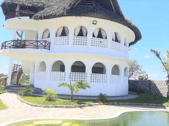 Luxury 2-bedroom guest suite in Mayungu, Malindi featuring ocean views, ensuite rooms, shared kitchen, furnished patio, tropical gardens, and a pristine swimming pool. Perfect self-catering coastal accommodation for only USD 100 per night.