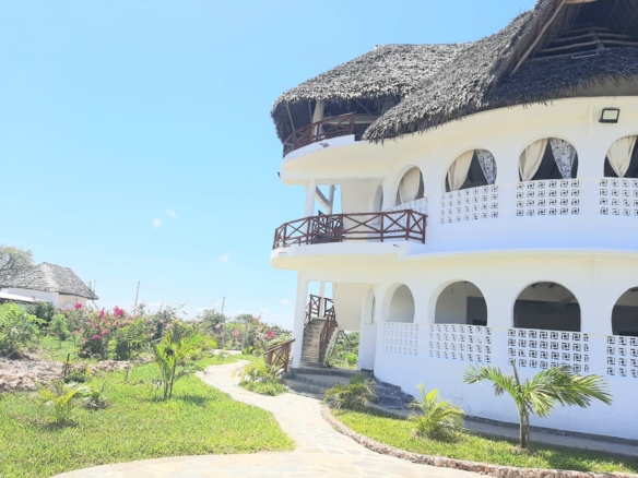 Luxury 2-bedroom guest suite in Mayungu, Malindi featuring ocean views, ensuite rooms, shared kitchen, furnished patio, tropical gardens, and a pristine swimming pool. Perfect self-catering coastal accommodation for only USD 100 per night.