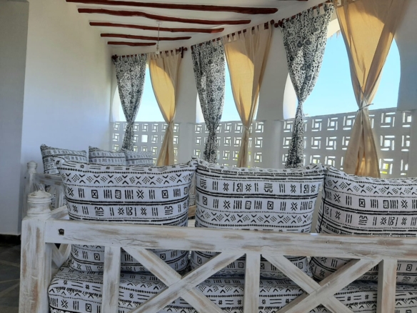 Luxury 2-bedroom guest suite in Mayungu, Malindi featuring ocean views, ensuite rooms, shared kitchen, furnished patio, tropical gardens, and a pristine swimming pool. Perfect self-catering coastal accommodation for only USD 100 per night.