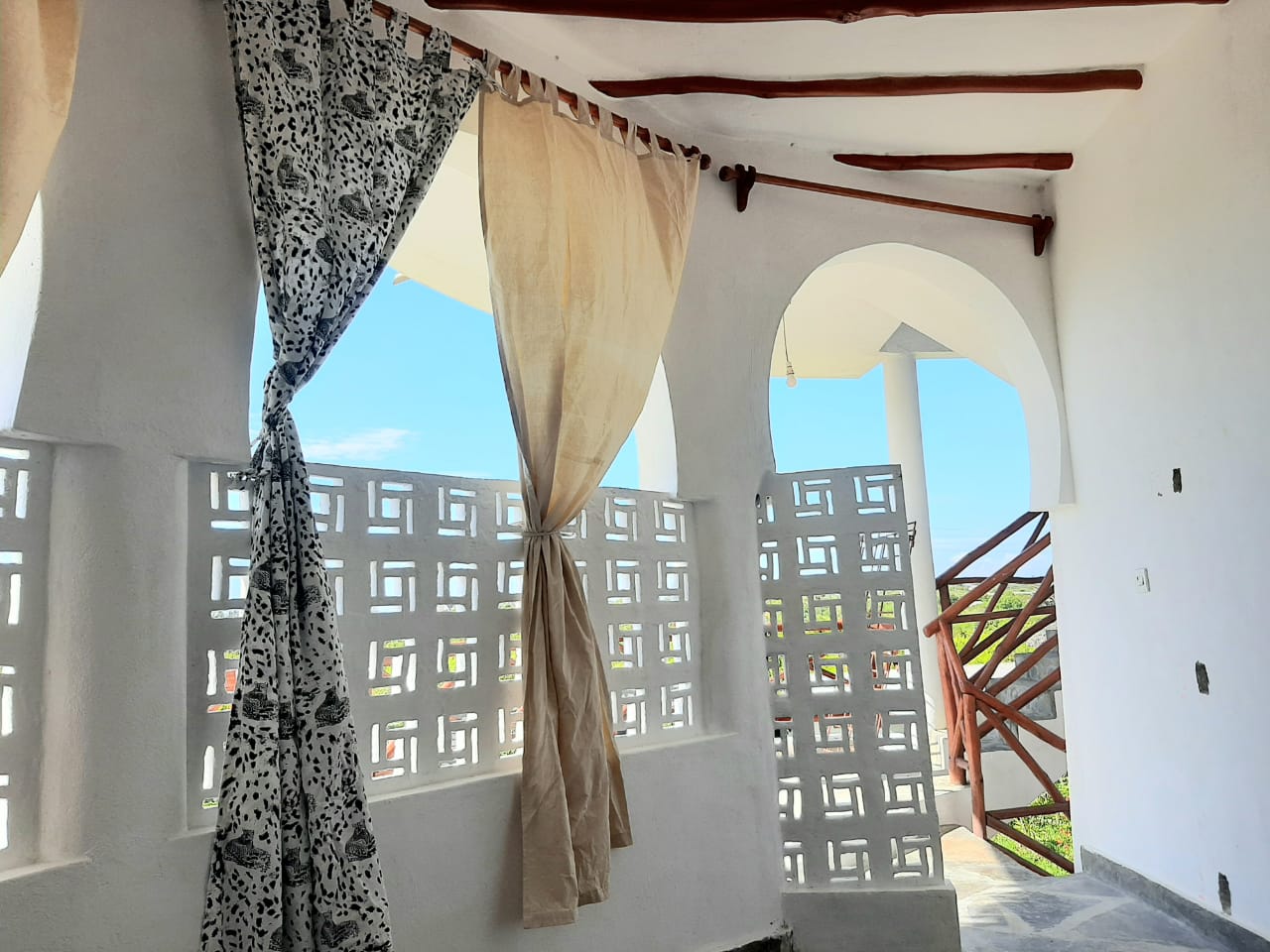 Luxury 2-bedroom guest suite in Mayungu, Malindi featuring ocean views, ensuite rooms, shared kitchen, furnished patio, tropical gardens, and a pristine swimming pool. Perfect self-catering coastal accommodation for only USD 100 per night.