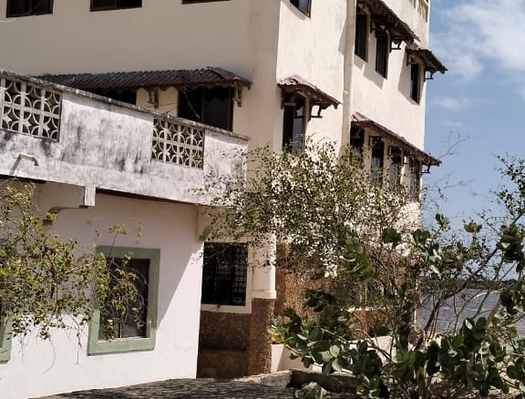 Quarter-acre second-row beach plot for sale in Lamu Wyoni with foundation and well, ideal for luxury coastal living or investment.