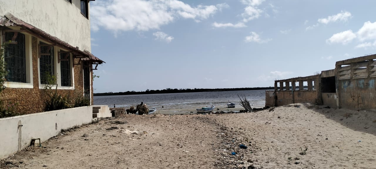 Quarter-acre second-row beach plot for sale in Lamu Wyoni with foundation and well, ideal for luxury coastal living or investment.