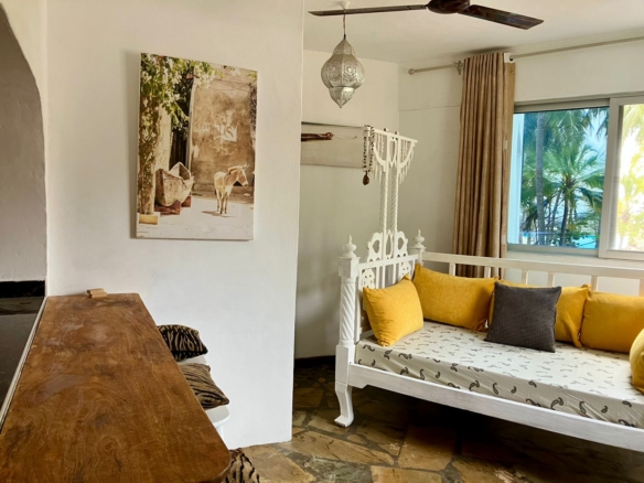 1.5-bedroom beachfront apartment at Oasis Malindi with ocean and pool views, available for short- and long-term rent.