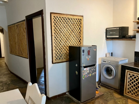 1.5-bedroom beachfront apartment at Oasis Malindi with ocean and pool views, available for short- and long-term rent.