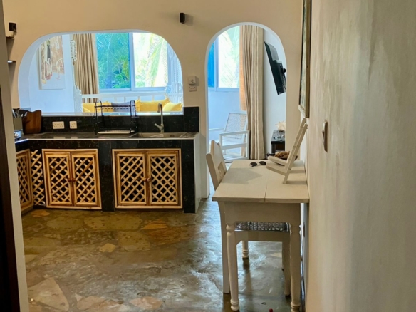 1.5-bedroom beachfront apartment at Oasis Malindi with ocean and pool views, available for short- and long-term rent.