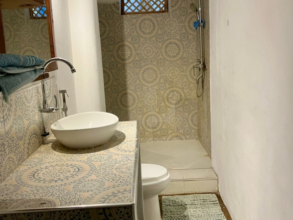 1.5-bedroom beachfront apartment at Oasis Malindi with ocean and pool views, available for short- and long-term rent.