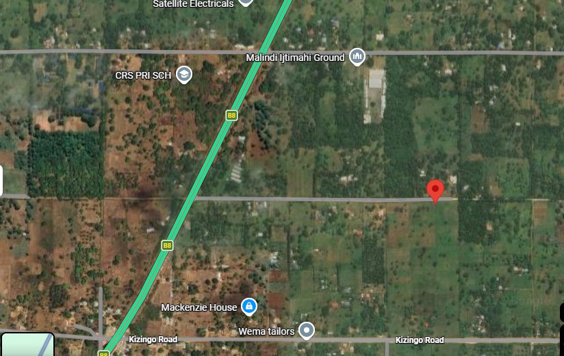 One-acre freehold plots for sale in Kizingo, watamu with red soil, flat land, and on-site utilities.