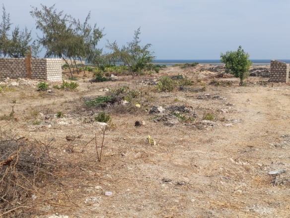 One-acre oceanfront cliff land for sale in Watamu featuring panoramic Indian Ocean views, prime location, and luxury development potential.