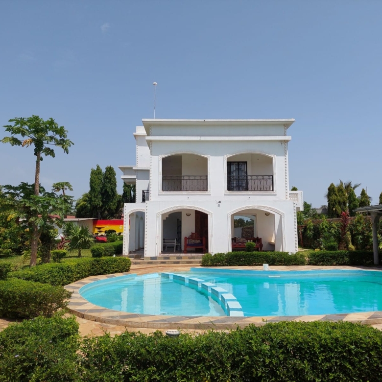 Luxury 4-bedroom furnished villa with private swimming pool for short stays in Casuarina, featuring a walled compound and premium amenities.