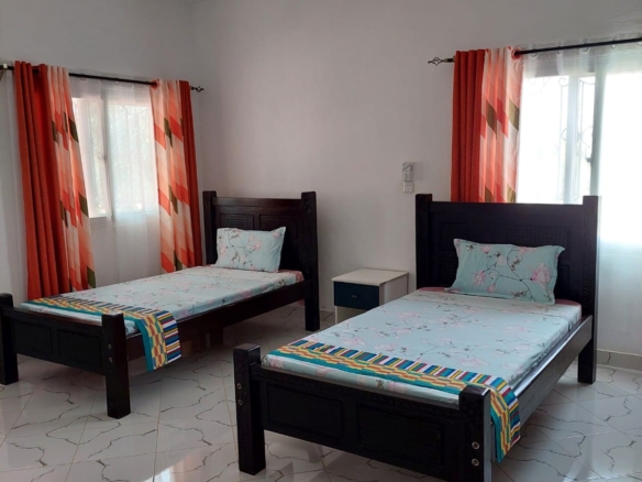 Luxury 4-bedroom furnished villa with private swimming pool for short stays in Casuarina, featuring a walled compound and premium amenities.