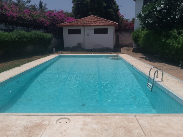 2-bedroom apartment for sale at Bubbles Residence in Casuarina featuring a swimming pool, gym, gated community security, and easy beach access.