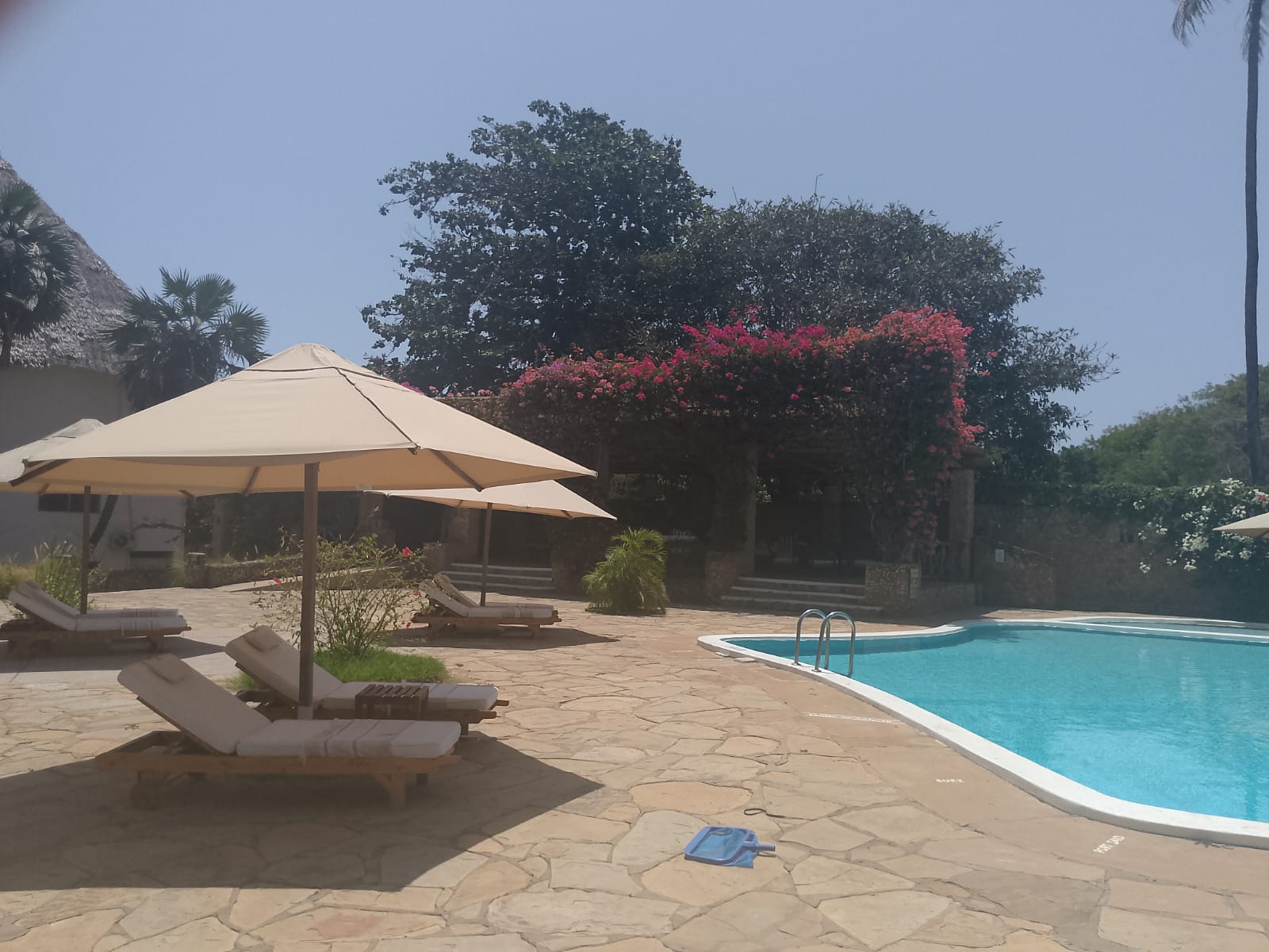 2-bedroom beachfront apartment for rent at Lawfords Malindi with swimming pools, gardens, entertainment facilities, and ocean views.