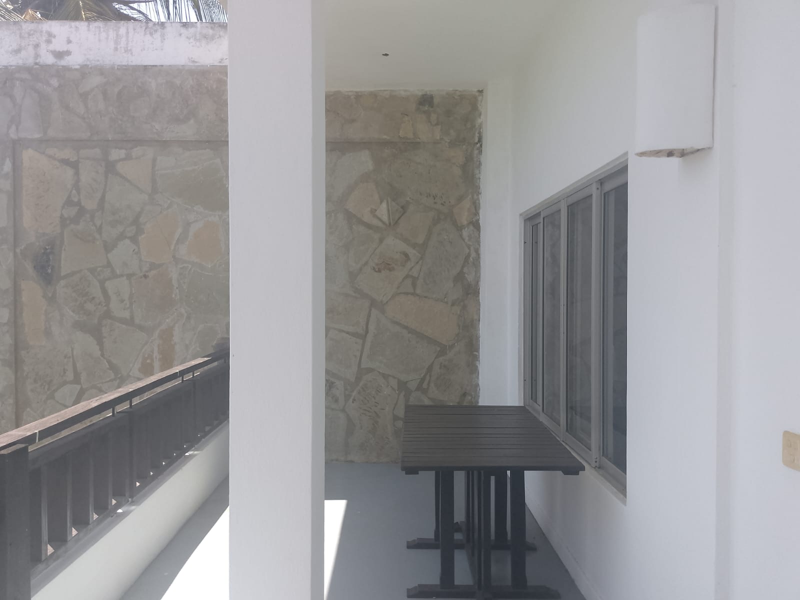 2-bedroom beachfront apartment for rent at Lawfords Malindi with swimming pools, gardens, entertainment facilities, and ocean views.