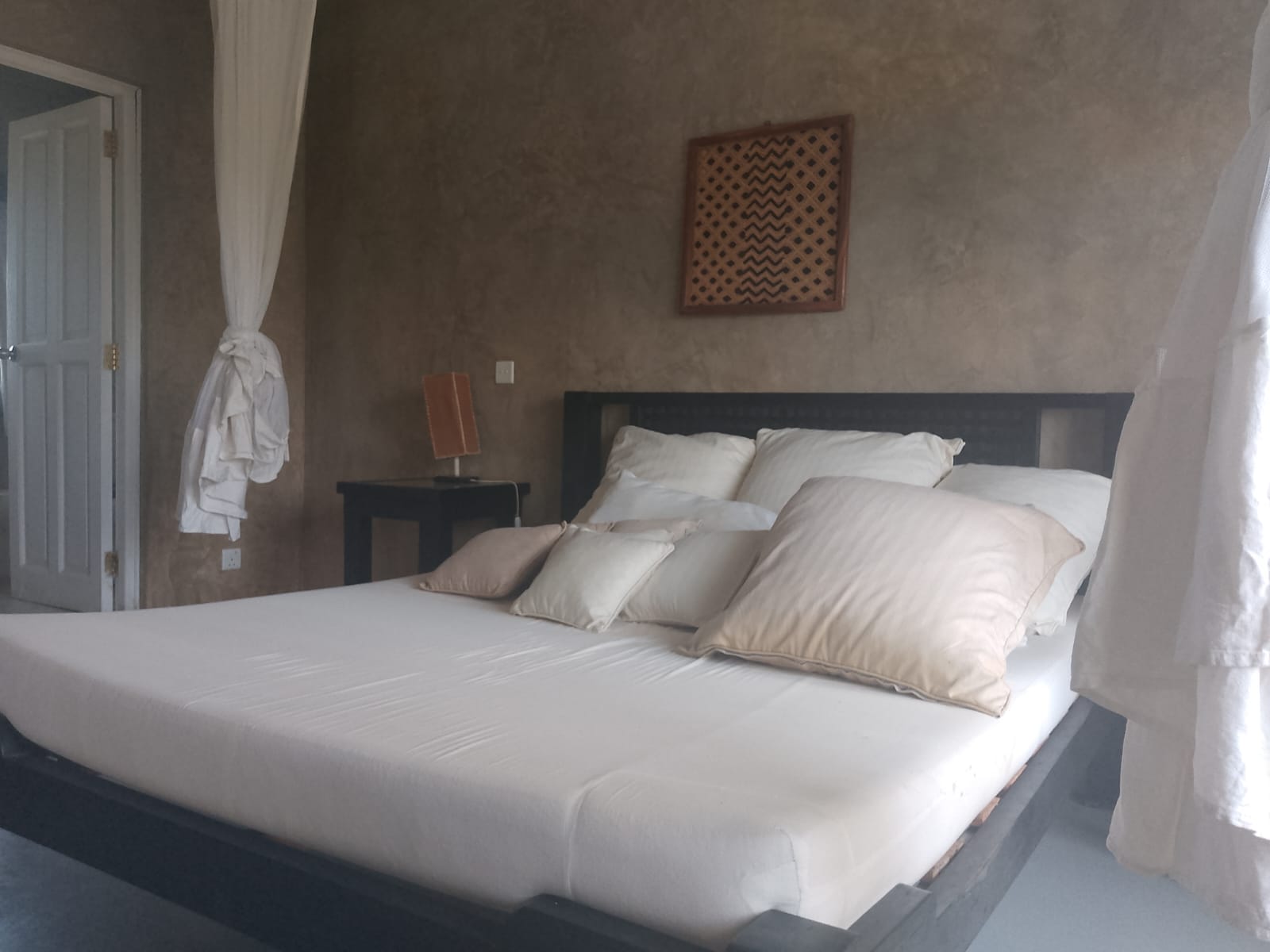 2-bedroom beachfront apartment for rent at Lawfords Malindi with swimming pools, gardens, entertainment facilities, and ocean views.