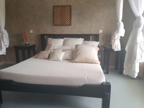 2-bedroom beachfront apartment for rent at Lawfords Malindi with swimming pools, gardens, entertainment facilities, and ocean views.