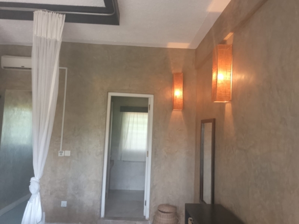 2-bedroom beachfront apartment for rent at Lawfords Malindi with swimming pools, gardens, entertainment facilities, and ocean views.