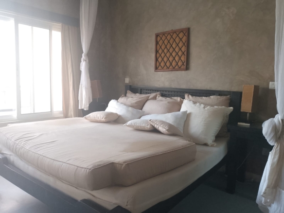 2-bedroom beachfront apartment for rent at Lawfords Malindi with swimming pools, gardens, entertainment facilities, and ocean views.