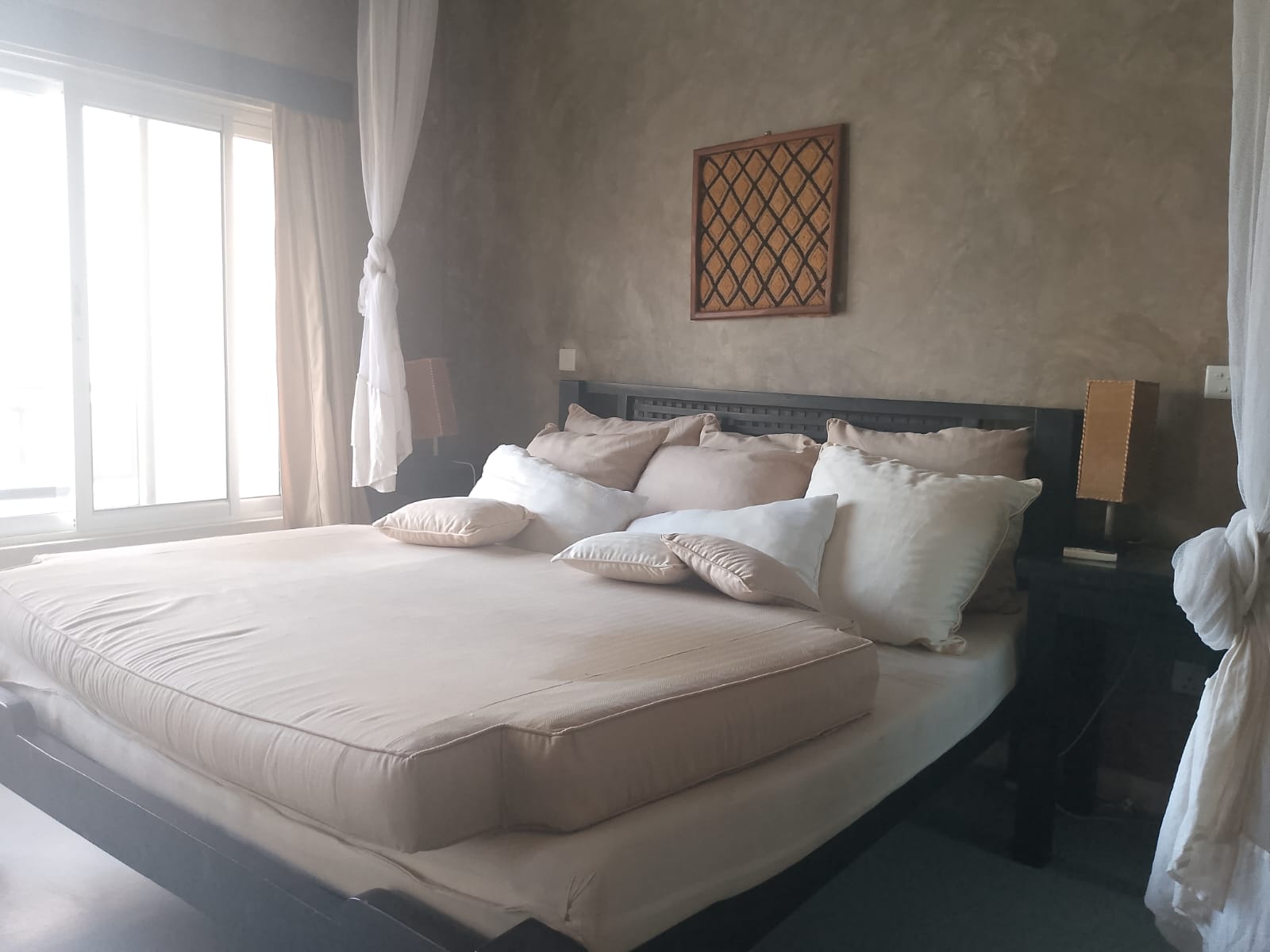 2-bedroom beachfront apartment for rent at Lawfords Malindi with swimming pools, gardens, entertainment facilities, and ocean views.