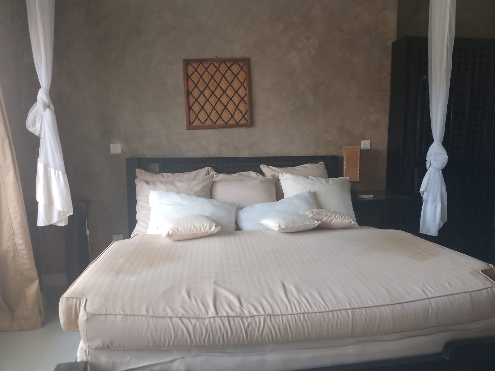 2-bedroom beachfront apartment for rent at Lawfords Malindi with swimming pools, gardens, entertainment facilities, and ocean views.