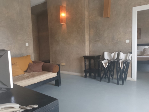 2-bedroom beachfront apartment for rent at Lawfords Malindi with swimming pools, gardens, entertainment facilities, and ocean views.